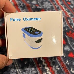 Blue and White Pulse Oximeter